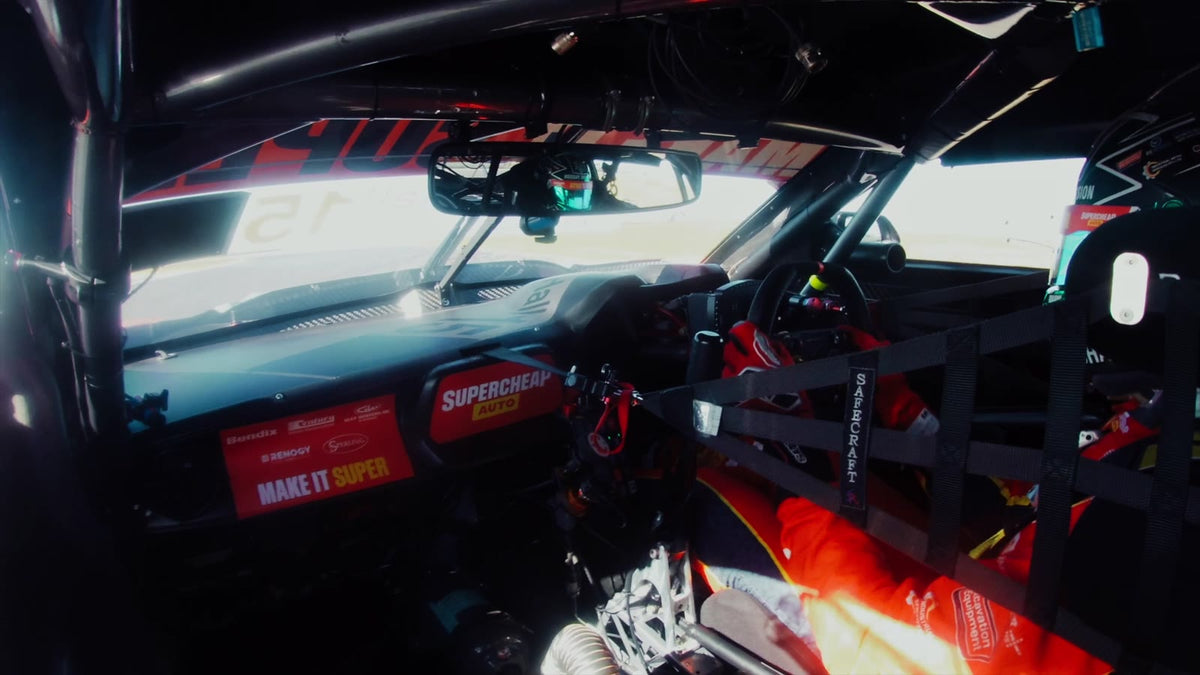 Team 18's Adrian Burgess in the garage discussing the RamHydrate race car drink system