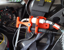 Race car Drink system Hydration Thirst Refreshment Water bottle Fluid intake Sports drink Performance Endurance Speed Mechanism Tubing Nozzle Driver Cockpit Fuel Pit stop Racing technology Sports equipment