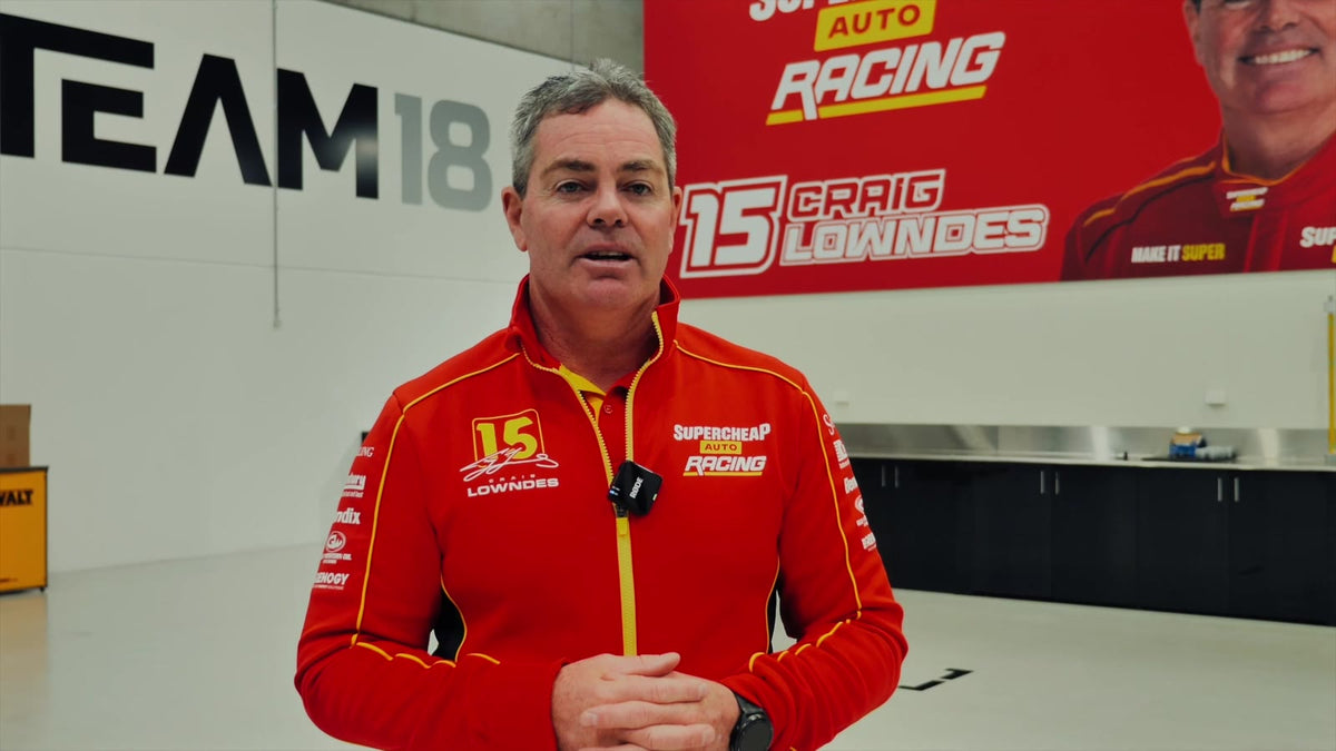 Craig Lowndes in the Team 18 workshop talking about the RamHydrate race car drink system